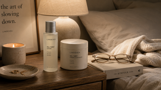Minimal skincare products on bedside table in warm lighting representing a simple skincare routine that fits naturally into everyday life