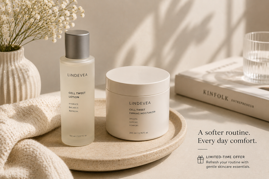 Minimal skincare products beside soft fabric and warm natural lighting representing a calm and gentle skincare routine.